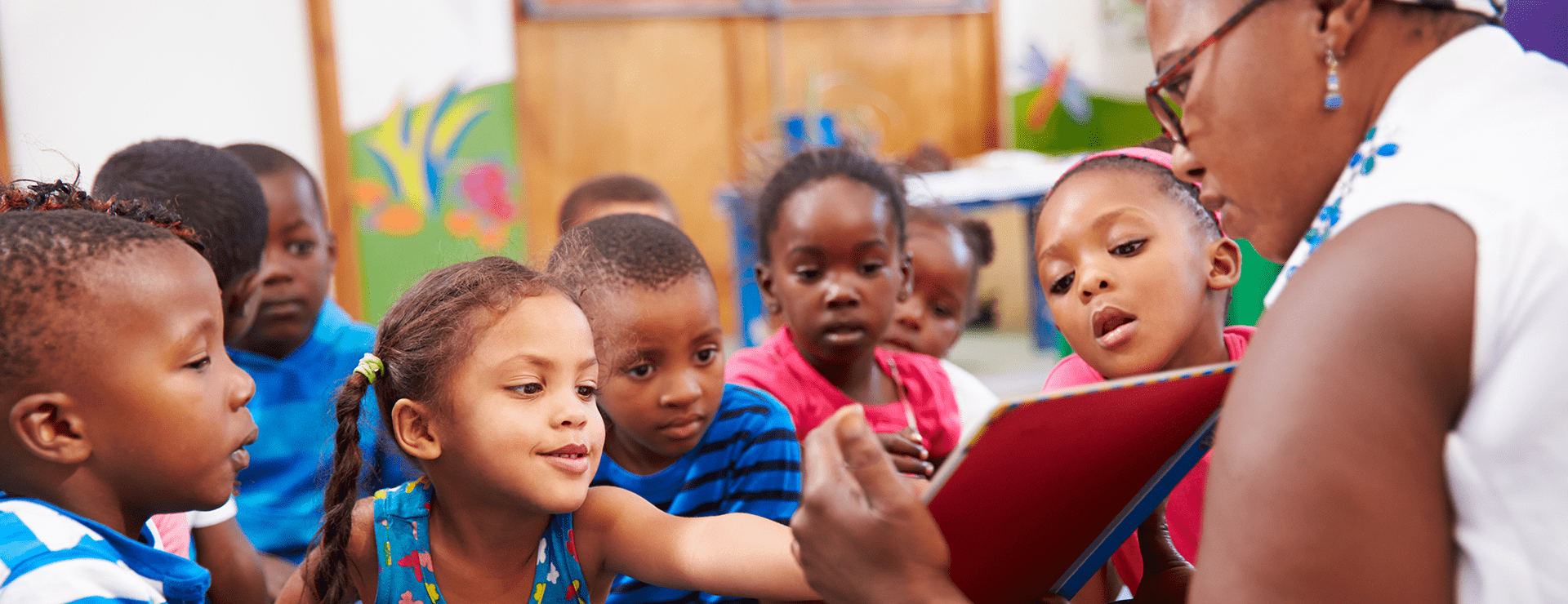 image of teacher reading to students